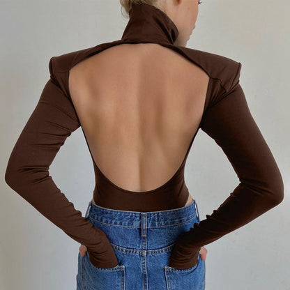 Model wearing the Bold Allure Open-Back Long Sleeve Bodysuit in brown, ideal for stylish travel outfits