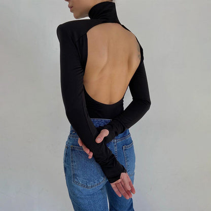 Model wearing the Bold Allure Open-Back Long Sleeve Bodysuit in black, ideal for stylish travel outfits