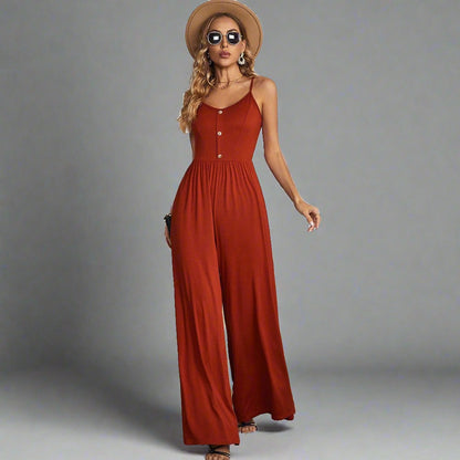 Elegant Explorer Wide-Leg Jumpsuit - rust color, fitted bodice, button-down front, adjustable spaghetti straps, wide-leg design, perfect for casual outings, city explorations, and elegant evening looks.