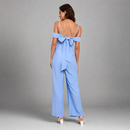 Elegant Off-Shoulder Jumpsuit with bow detail at the back, wide-leg silhouette, and adjustable spaghetti straps, available in various colors.