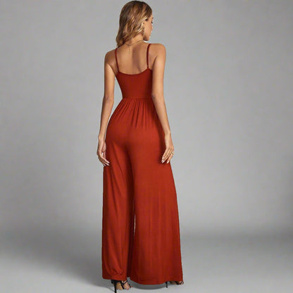 Elegant Explorer Wide-Leg Jumpsuit - rust color, fitted bodice, button-down front, adjustable spaghetti straps, wide-leg design, perfect for casual outings, city explorations, and elegant evening looks.