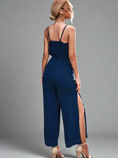 Woman wearing the Oasis Wide-Leg Jumpsuit in blue perfect for vacation.