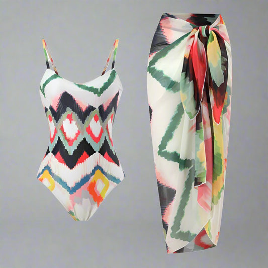 Colorful geometric print swimsuit with adjustable straps and matching sarong cover-up.