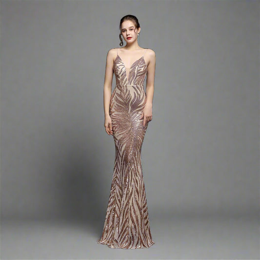 Model wearing Luxury Traveler's Sequin Gala Gown in gold, featuring a body-hugging silhouette with intricate sequin details and spaghetti straps